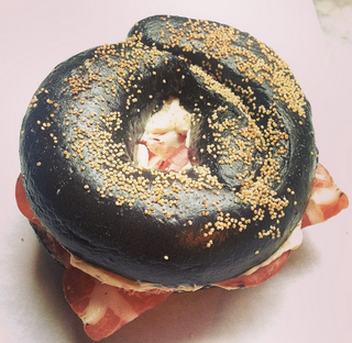 Illustration for article titled All black squid ink bagel with Jamón Ibérico is yummy dark magic food